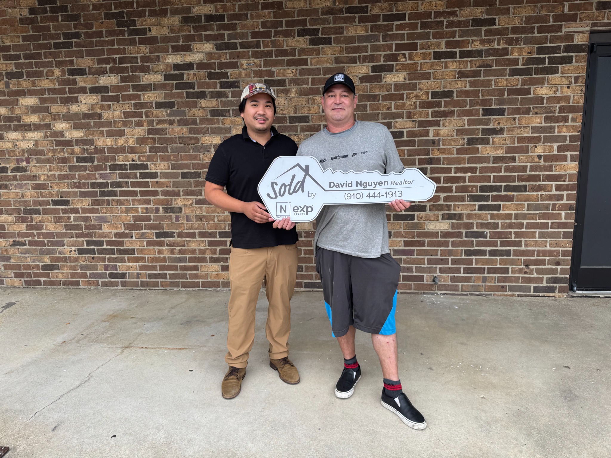 David Nguyen with a client after a successful closing